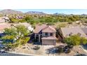 Two-story house with desert landscaping, a two-car garage, and mountain views at 3055 N Red Mountain Rd # 149, Mesa, AZ 85207