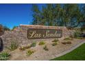 Las Sendas community entrance with stonework and landscaping at 3055 N Red Mountain Rd # 149, Mesa, AZ 85207