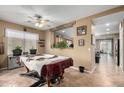 Spacious dining area with a pool table and access to kitchen at 36248 W Cartegna Ln, Maricopa, AZ 85138