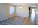 Bright dining room with carpeted floor and view to kitchen at 36285 N Mirandesa Dr, San Tan Valley, AZ 85143