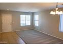 Living room with carpeted floor and neutral walls at 36285 N Mirandesa Dr, San Tan Valley, AZ 85143