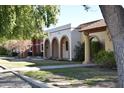 Three Spanish-style homes with covered entryways and landscaping at 431 W Knox Rd, Chandler, AZ 85225