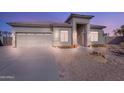 House exterior featuring a neutral color scheme and attached garage at 43102 W Venture Rd, Maricopa, AZ 85138