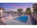 Relaxing backyard with a refreshing pool and ample space for entertaining at 43102 W Venture Rd, Maricopa, AZ 85138