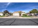 House exterior showcasing a well-maintained lawn and driveway at 4710 E Torrey Pines Ln, Chandler, AZ 85249