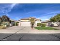 Single story home with a two car garage and desert landscaping at 4710 E Torrey Pines Ln, Chandler, AZ 85249