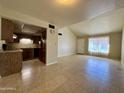 Open concept kitchen and living area with tile floors at 4730 W Rose Ln, Glendale, AZ 85301