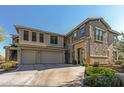 Two-story townhome showcasing attached garage and front landscaping at 5100 E Rancho Paloma Pkwy # 1014, Cave Creek, AZ 85331