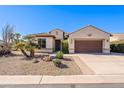 Single-story home with brown garage door and desert landscaping at 5352 N Gila Trail Dr, Eloy, AZ 85131