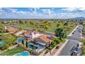 Stunning aerial view showcasing the home's location, pool, and surrounding landscape at 5402 E Paradise Ln, Scottsdale, AZ 85254