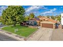 Charming single story home with a large grassy yard and mature trees at 5402 E Paradise Ln, Scottsdale, AZ 85254