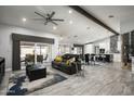 Open concept living room, kitchen and dining area with hardwood floors at 6102 E Nisbet Rd, Scottsdale, AZ 85254