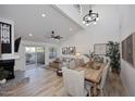 Bright dining room with a large wooden table and hardwood floors at 7904 E Pepper Tree Ln, Scottsdale, AZ 85250