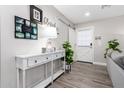 Bright and airy entryway with console table and farmhouse decor at 8431 E Stella Ln, Scottsdale, AZ 85250