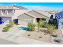 New construction home with a two-car garage and solar panels at 8637 N 168Th Dr, Waddell, AZ 85355