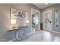 Light and bright entryway featuring modern décor and a glass decorative door with a side window at 36925 N Stoneware Dr, Queen Creek, AZ 85140