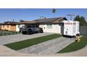 Modern home exterior with artificial turf and driveway at 4016 W Wagon Wheel Dr, Phoenix, AZ 85051