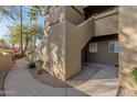 Condo building exterior with walkway and landscaping at 5335 E Shea Blvd # 1115, Scottsdale, AZ 85254