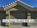 One car garage with unit, featuring light taupe exterior and attached to the building at 5335 E Shea Blvd # 1115, Scottsdale, AZ 85254