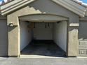 Empty one car garage with overhead light and shelving at 5335 E Shea Blvd # 1115, Scottsdale, AZ 85254