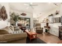 Living room with hardwood floors, comfortable furniture, and access to a patio at 6601 S Oakmont Dr, Chandler, AZ 85249