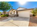 House exterior with driveway and landscaping, showcasing curb appeal at 8209 W Lane Ave, Glendale, AZ 85303