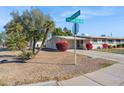 House exterior view, showcasing street address and landscaping at 10288 W Snead N Cir, Sun City, AZ 85351