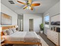 Spacious main bedroom with a ceiling fan and large windows at 11468 E Sunflower Ln, Florence, AZ 85132