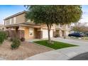 Two-story house with a landscaped yard and a two-car garage at 11935 N 148Th Ave, Surprise, AZ 85379