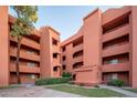 Exterior view of a two-story condo building with landscaping at 12212 N Paradise Village S Pkwy # 134, Phoenix, AZ 85032