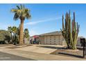 Mid-century modern home with desert landscaping and a two-car garage at 12526 W Paintbrush Dr, Sun City West, AZ 85375