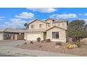 Two-story house with a large yard and a two-car garage at 12618 W Catalina Dr, Avondale, AZ 85392