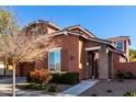 Two-story house with brown exterior, two-car garage, and landscaped front yard at 13627 N 150Th Ave, Surprise, AZ 85379