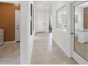 Bright hallway with tile flooring and access to other rooms at 1649 N Fenway Dr, Florence, AZ 85132