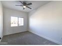 Simple bedroom with gray carpet and ceiling fan at 205 E Jackson Ave, Buckeye, AZ 85326