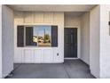 Exterior front entrance with dark door and shutters at 205 E Jackson Ave, Buckeye, AZ 85326