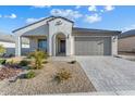 New construction home with attractive curb appeal and desert landscaping at 26330 W Kimberly Way, Buckeye, AZ 85396