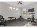 Home gym with exercise bike, weights, and bench at 28225 N 65Th Ln, Phoenix, AZ 85083