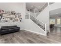 Modern staircase with metal railing and gray walls at 28225 N 65Th Ln, Phoenix, AZ 85083