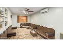 Spacious living room with unique seating and ceiling fan at 2825 N 33Rd Pl, Phoenix, AZ 85008