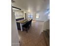 Kitchen with an island, stainless steel appliances, and dark cabinets at 2826 E Augusta Ave, Chandler, AZ 85249