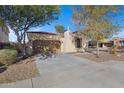 Charming single-story home featuring a well-maintained desert landscape and attached two-car garage at 29798 N 121St Dr, Peoria, AZ 85383