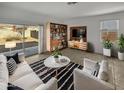 Living room with patio access and built-in shelving at 30734 W Clarendon Ave, Buckeye, AZ 85396