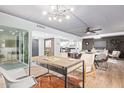 Bright dining area with a large wooden table and modern chairs at 351 E Thomas Rd # D208, Phoenix, AZ 85012