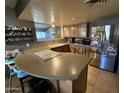 Kitchen boasts a large island and modern appliances at 42213 N 3Rd St, Phoenix, AZ 85086