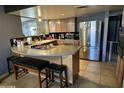 Well-equipped kitchen with stainless steel appliances and a breakfast bar with seating at 42213 N 3Rd St, Phoenix, AZ 85086