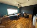 Bright office space with hardwood floors, ample natural light, and custom built-in desk at 42213 N 3Rd St, Phoenix, AZ 85086