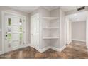 Light and airy entryway with a tiled floor and shelving for storage at 4525 E Calle Ventura --, Phoenix, AZ 85018