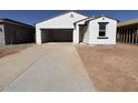 New construction home with a two-car garage and a concrete driveway at 47748 W Kenner Dr, Maricopa, AZ 85139