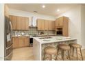 Beautiful kitchen featuring modern cabinetry, stainless steel appliances and quartz countertops at 6137 E Roland St, Mesa, AZ 85215